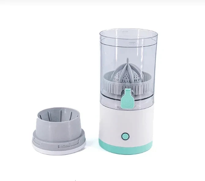 Small white and teal juicer on a white background